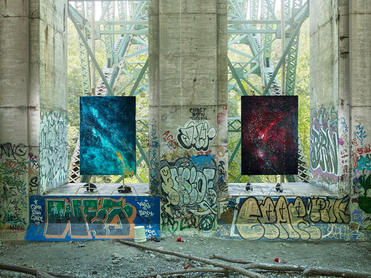 Space-themed paintings installed under graffiti-covered bridge.