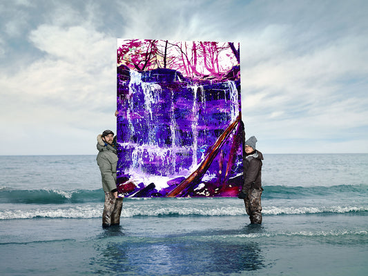 Vibrant waterfall painting held in lake shallows by artists.