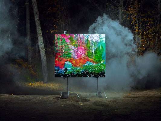 Illuminated forest painting with fog in nighttime woods.