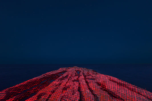Red and black checkered pattern against a dark blue background