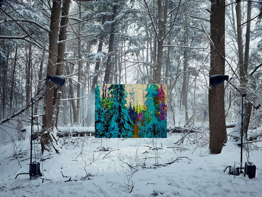 Painting in snowy forest installation with studio lights.